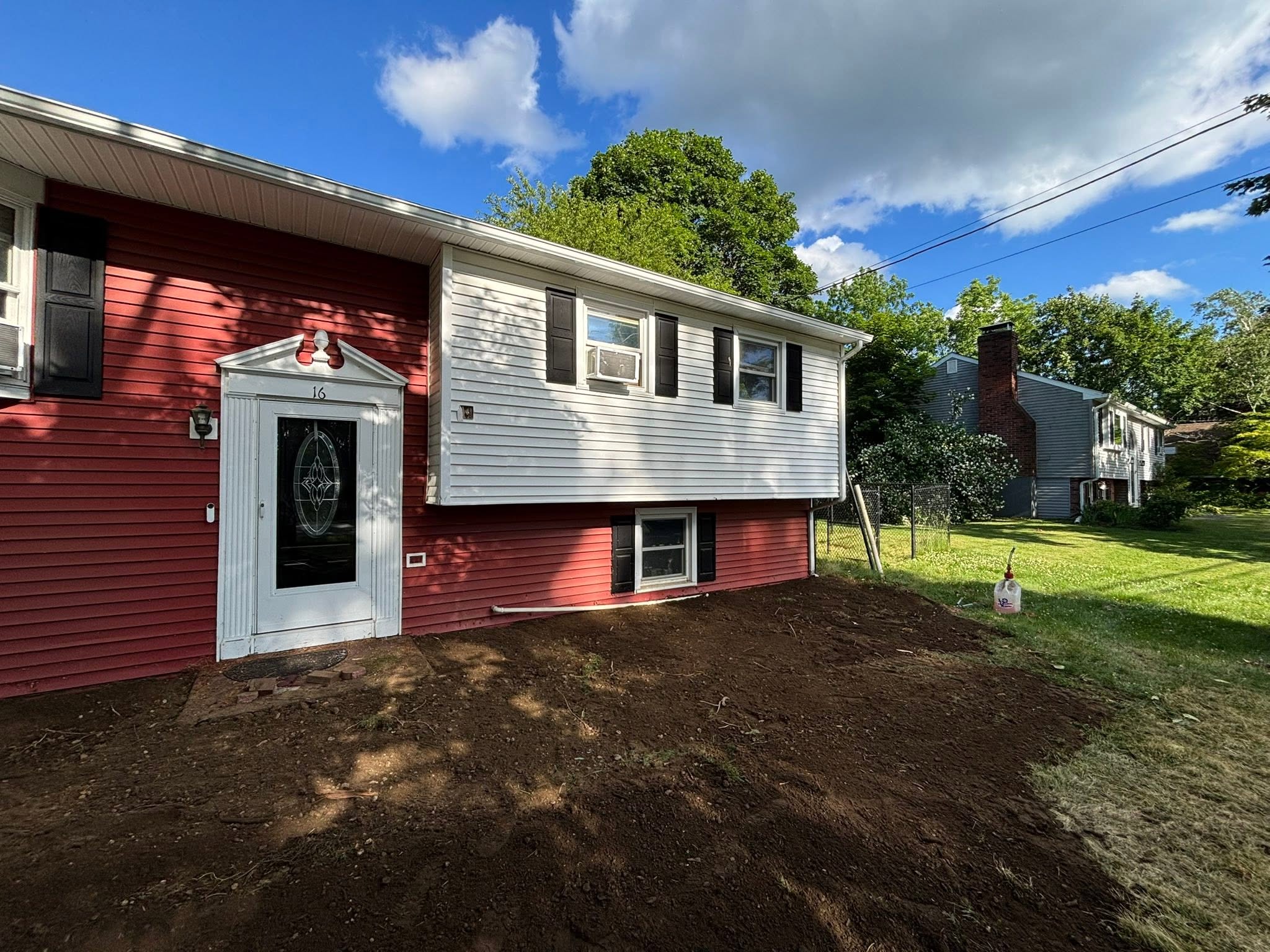 Clean grade after mini excavator shrub removal in Spencer, MA